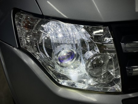 Замена линз в фарах Mitsubishi Pajero 4 на Bi Led Dixel D1000